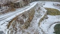 Snow covered gravel road at rock quarry Royalty Free Stock Photo