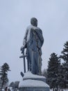 Snow covered gravestone statue in Indiana