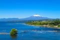 Snow covered hight volcano summit above the lake Royalty Free Stock Photo