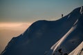 snow-covered hill with powdery snow and a man skier on it. Ski touring and freeride concept