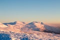 Snow covered hillside closeup in wintertime. mountain. Christmas