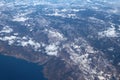 Snow-covered hilly terrain and Adriatic coast, aerial photograph. Croatia