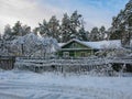 snow-covered house in a village pine Royalty Free Stock Photo