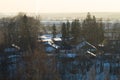 Snow covered houses with the gardens in winter. wooden houses in the forest aerial view. rural landscape Royalty Free Stock Photo