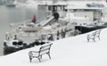 Snow covered iron bench