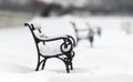 Snow covered iron bench