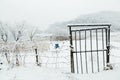 Snow covered metal gate and wire fence in Uiwang, Korea Royalty Free Stock Photo