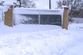 Snow-covered iron gates. winter wrought fence gates