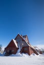 Snow covered Kiruna Church in the shape of a Sami goahti in Kiruna, Sweden
