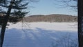 Snow Covered Lake And Hill With Bare Trees Mont Saint Bruno National Park, Quebec