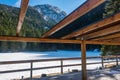 Snow-covered lake with mountains in the background