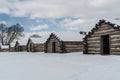 Snow Covered Log Cabins at Valley Forge Historical Park Royalty Free Stock Photo