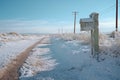 a snow-covered mailbox in a desert during winter Royalty Free Stock Photo