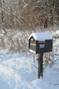 Snow covered mailbox on rural road on winter morning Royalty Free Stock Photo