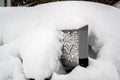 Snow Covered Mailbox. Winter snow caps a mailbox. Snow chaos and catastrophe alert in Bavaria south Germany Winter 2019 Royalty Free Stock Photo