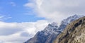 Snow Covered Mountain Amongst Clouds Royalty Free Stock Photo