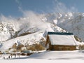 Snow covered mountain & clouds