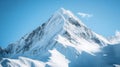 Snow-Covered Mountain Peak with Blue Sky and Clouds Royalty Free Stock Photo
