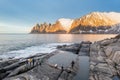 Snow covered mountain range on coastline in winter, Norway. Senja panoramic aerial view, Troms county, Fjordgard