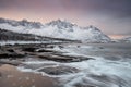 Snow covered mountain range on coastline in winter, Norway. Senja panoramic Troms county, Fjordgard.