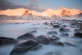 Snow covered mountain range on coastline in winter, Norway. Troms county, Fjordgard