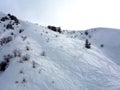 Snow covered mountain with ski tracks Royalty Free Stock Photo