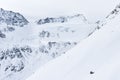 Snow-covered mountain slope. The Alpine landscape. High mountain