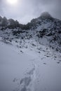 snow covered mountain tourist hiking trails