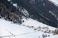Snow-covered mountain village at the foot of the mountain in winter afternoon, ski resort Ischgl Tyrol AlpsÃÅ½