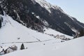 Snow-covered mountain village at the foot of the mountain in winter afternoon, ski resort Ischgl Tyrol AlpsÃÅ½