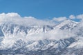 Snow covered mountains above Genoa Nevada with dramatic clouds. Royalty Free Stock Photo