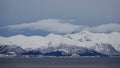 Snow covered mountains and atlantic ocean on Hinnoya near Myrland in winter in Norway