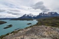 Snow covered mountains with the light blue ocean in front in Torres del Paine National Park in Chile, Patagonia Royalty Free Stock Photo