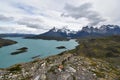 Snow covered mountains with the light blue ocean in front in Torres del Paine National Park in Chile, Patagonia Royalty Free Stock Photo