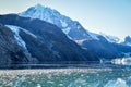 Snow covered mountains with pieces of ice from glaciers floating