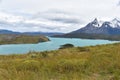 Snow covered mountains with the light blue ocean in front in Torres del Paine National Park in Chile, Patagonia Royalty Free Stock Photo