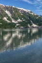 Snow covered mountains mirrored in Disenchantment Bay, Alaska, USA