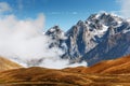 Snow-covered mountains in the mist. Autumn at Koruldi Lake. Euro Royalty Free Stock Photo