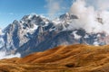 Snow-covered mountains in the mist. Autumn at Koruldi Lake. Euro Royalty Free Stock Photo