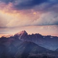 Snow-covered mountains in the mist. Autumn at Koruldi Lake. Royalty Free Stock Photo