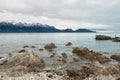 Snow covered mountains on ocean shore Royalty Free Stock Photo