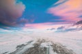 Snow-covered Open Slippy Road During A Snowstorm Blizzard In Winter. Altered Colorful Sunset Sunrise Sky. Dangerous