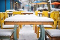 snow-covered outdoor cafe tables Royalty Free Stock Photo