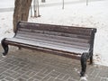 Snow covered park bench with first snow Royalty Free Stock Photo