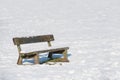 Snow covered park bench Royalty Free Stock Photo