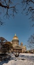 Snow-covered Park in front of St. Isaac's Cathedral in St. Petersburg - Russia in the spring sun Royalty Free Stock Photo