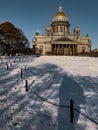 Snow-covered Park in front of St. Isaac's Cathedral in St. Petersburg - Russia in the spring sun Royalty Free Stock Photo