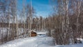 A snow-covered path in a birch grove goes down the hill. Royalty Free Stock Photo