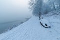 Snow covered path next to Tisza river in Hungary on a foggy morning Royalty Free Stock Photo