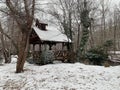 Snow covered pavilion in the woods Royalty Free Stock Photo